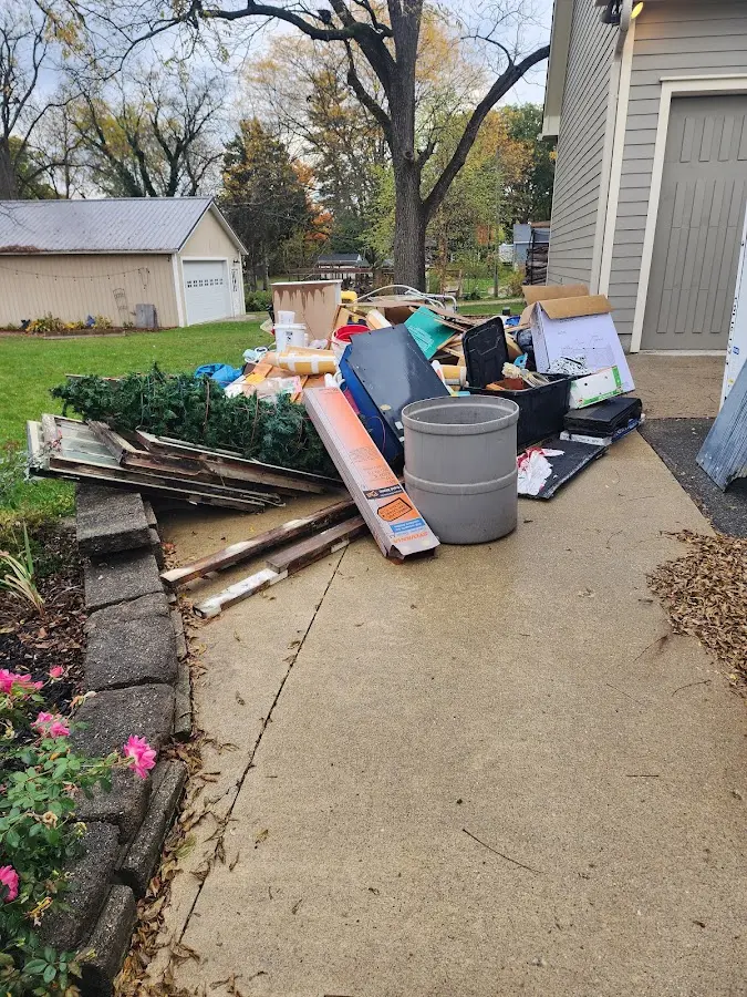 Dumpster being loaded with debris for 3 Yard Dumpster Rental in Lakewood